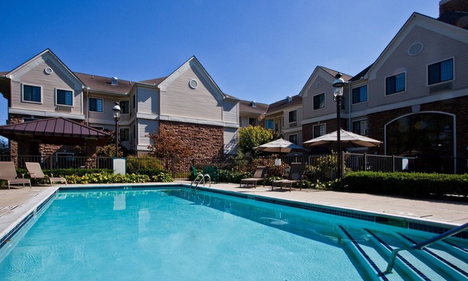Shelby Township Apartment | Equipped Suite | Free Breakfast, 24h Business Center + Seasonal Pool