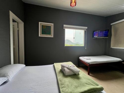 Niteroi House | Espaço Verano- quarto Família