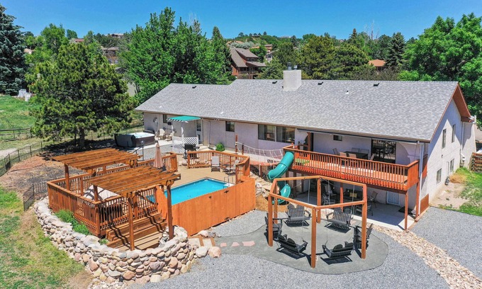 Park Vista House | Evergreen Luxe! Backyard Oasis w/Pool & Hot Tub!