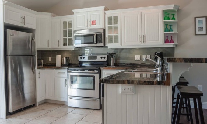 Stanley Bridge Condo | Executive suite with outdoor hot tub and fire pit | Golf View, close to pool