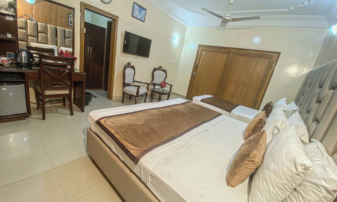 D.H.A. Hotel | Executive Triplet Room with One King and One Single Beds, Fully Equipped!