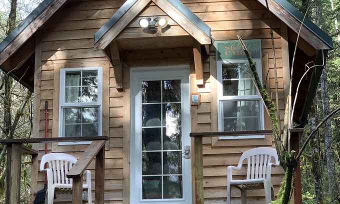 Ashford Cabin | Experience a custom built tiny home cabin near Mt Rainier National Park. It sleeps up to three! Firepit, access to shared hot tub, walking distance to Copper Creek Restaurant