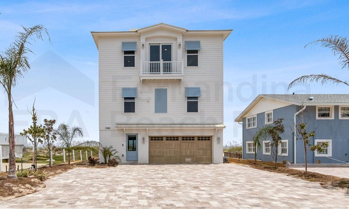 Ocean Cay House | Experience oceanfront luxury at 1088 S. Fletcher Ave, a spacious 5-bedroom house