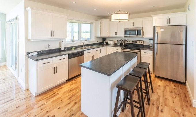 Stanley Bridge House | Family friendly home with private outdoor hot tub & fire pit