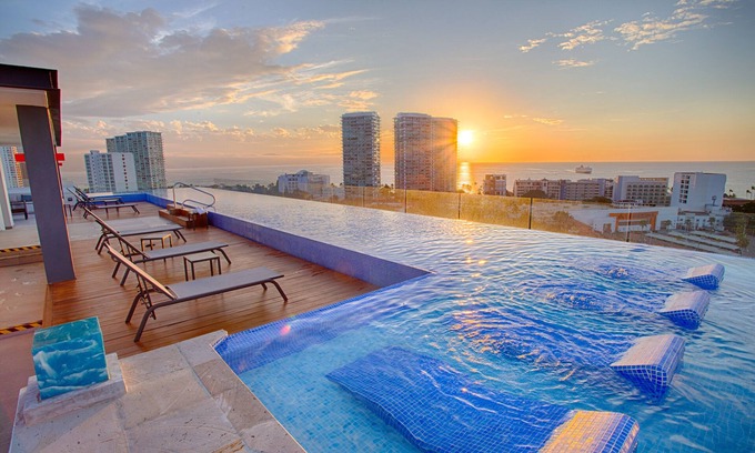 North Hotel Zone Condo | Family-Friendly 1BR + Flex | Pool, Gym, Parking