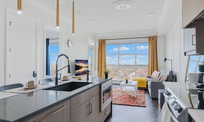 Currie Barracks Condo | Family Stylish 2BR Condo w/City View, DT, Balcony, F/Parking & In-Suite Laundry!