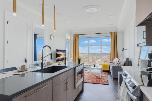 Currie Barracks Apartment | Family Stylish 2BR Condo with City View, DT, Balcony, Free Parking & In-Suite Laundry!