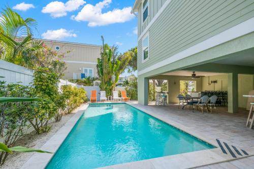 Bradenton Beach House | Family Tides - 2 Homes in 1 Steps to Beach w Rooftop Views Heated Pool Close to Bridge St