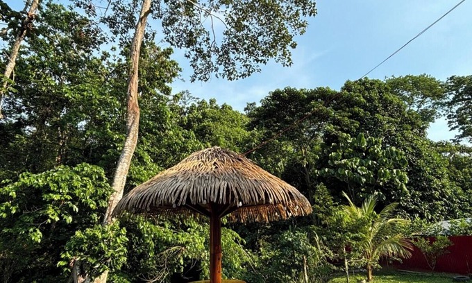 Sauce House | Family vacation home with a view of the forest and access to a small river.