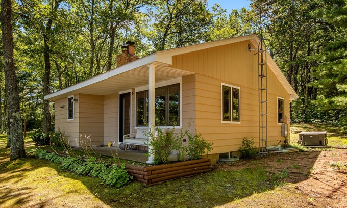 Lac du Flambeau House | Fantastic lakefront escape with dock, boat slip, fast WiFi, firepit, & gas grill