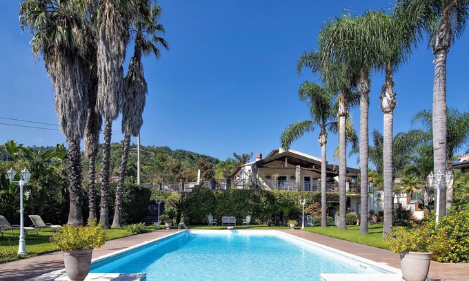Macchia House | Fantastic vacation home with paradisiacal garden at the foot of the volcano Etna.