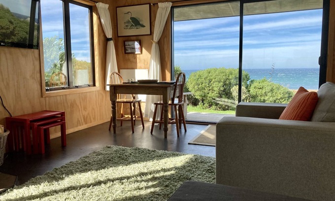 Tora Cottage | Far Side Bach Tora - pristine NZ coastline on your doorstep