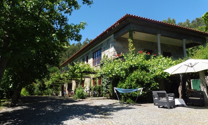 Portela House | Farmhouse accommodation for 10 people, with private pool, BBQ, garden and Wifi .