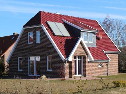 Middelsbur House | Ferienhaus in Dornum am Wasserschloss
