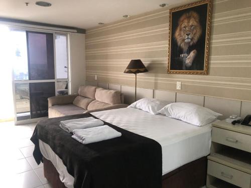 Centro Hotel | Flat Hotel morador 1110 Suíte,Sofá,Varanda,Cozinha