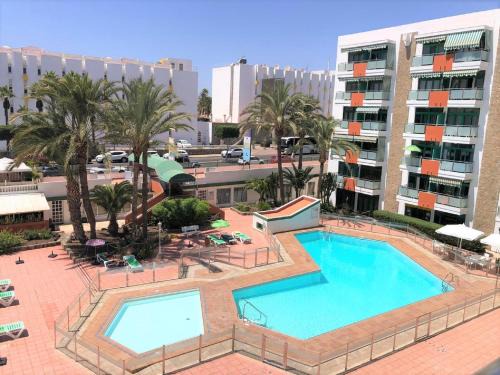 Playa del Ingles Apartment | FM Beach Home - Renovated Apartment with swimming pool near Maspalomas Dunes & Beach
