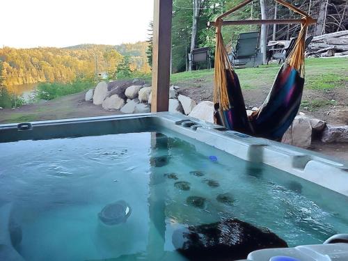 Sainte-Marguerite-du-Lac-Masson House | Forest Chalet with Hot Tub & Lake Views near Mont Saint-Sauveur