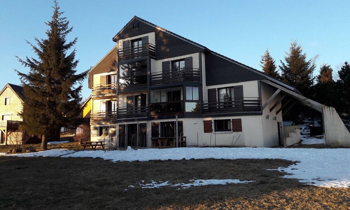 Besse-et-Saint-Anastaise Apartment | Quiet apartment with parking in Super Besse