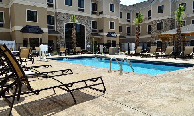 Jacksonville Condo | Free Breakfast. Outdoor Pool. Shared BBQ. Near Marine Corps.