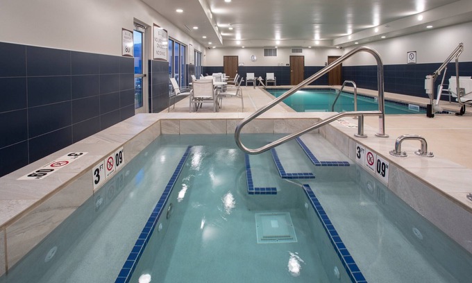 Rapid City Condo | Free Breakfast. Pool & Hot Tub. Near Rushmore Crossing Shopping Complex! Your Next Trip!