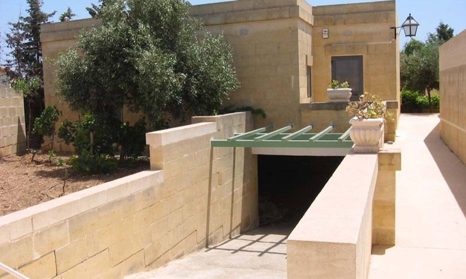 Xewkija House | Fully detached bungalow with amazing lagoon overflowing pool & walled garden