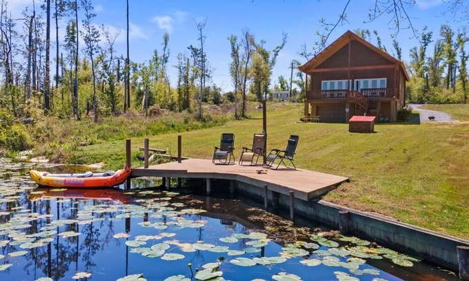 Youngstown House | Fun fishing river cabin 23mi to beach with private dock 3BD 2BA