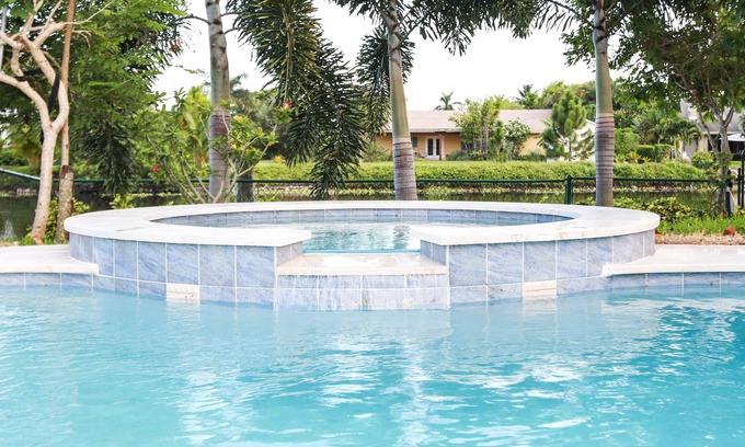 Tropic Palms House | Fun Magical Home On Canal-Relaxing Pool -Spa-Enjoy Fishing-Kayaks-WiFi-Near All