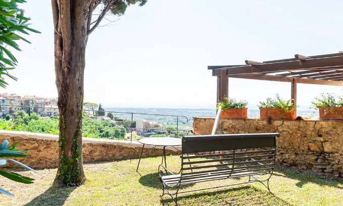 Castagneto Carducci Apartment | Garden Apartment with Sea view - hilltop Medieval village, 10' from the Beach.