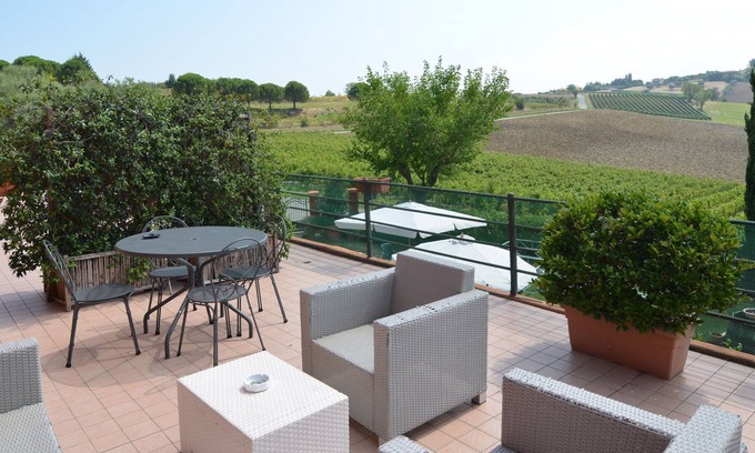 Passano Apartment | Garden-View Apartment in Coriano Italy with Swimming Pool