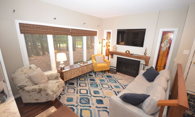 Maple City Condo | Glen Arbor condo in the woods w/screened porch, A/C, washer/dryer