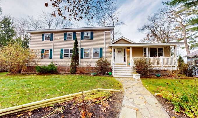 Center Ossipee House | Glistening lakefront home with fireplace, kitchen, dock, canoe, grill, & patio