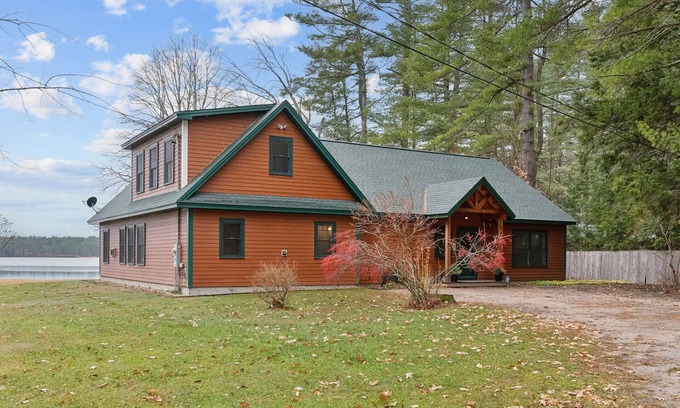 Naples Ski Chalet | Gorgeous luxury home with large sandy beach and sunset views on Brandy Pond!