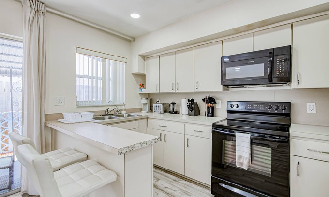 Coral Ridge Isles Apartment | Gorgeous & sun-soaked oasis with pool, furnished patio, generous yard, & AC