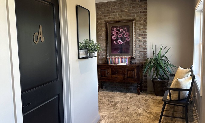 Sugarcreek Apartment | Great bedroom with private bathroom & Lounge above a local Diner