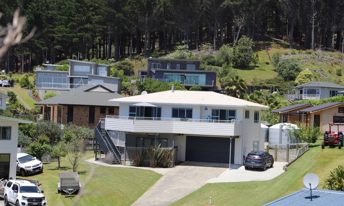 Opito Bay House | Great views, great family bach, super close to the beach and a spa pool!