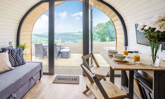 Whitland Cottage | Hand picked for its stunning countryside views and private Scandinavian log fired hot tub.