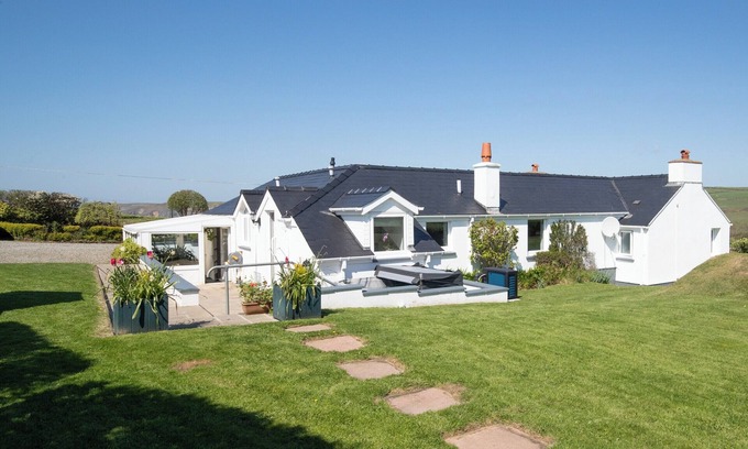 Roch Cottage | Hand picked for its stunning sea views, hot tub and within walking distance of the beach.