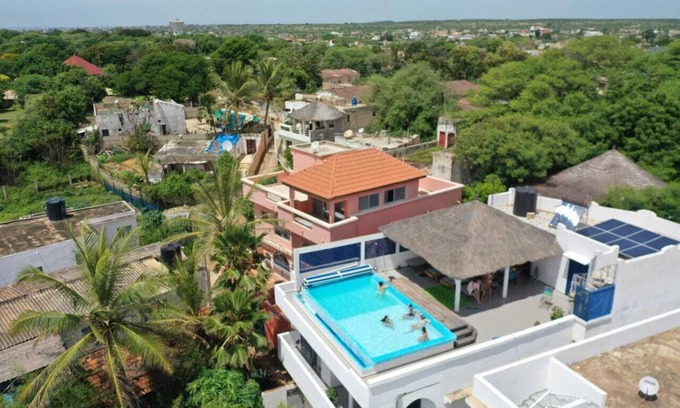 Popenguine Villa | Heated rooftop pool villa with panoramic ocean views.