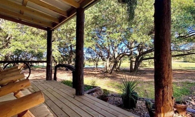 Cat Spring Cabin | Hideaway Cabin secluded & nestled in the live oaks with private outdoor Hot Tub!
