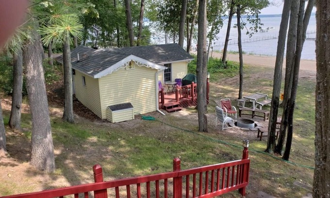 Higgins Lake House | Higgins Lakefront Cozy Beach House with Private Boat Mooring Onsite - Brass Bell