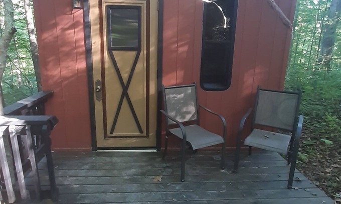 Mineralwells Cabin | Hike to your tiny cabin in the woods, we will leave the solar lights on for you.