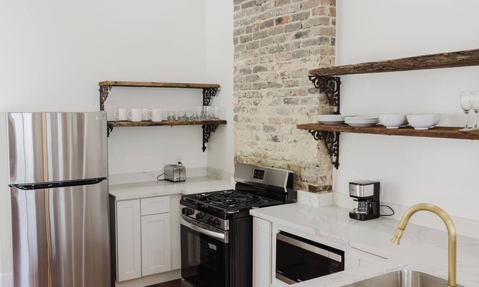 Faubourg Delassize House | historic uptown shotgun off st Charles ave