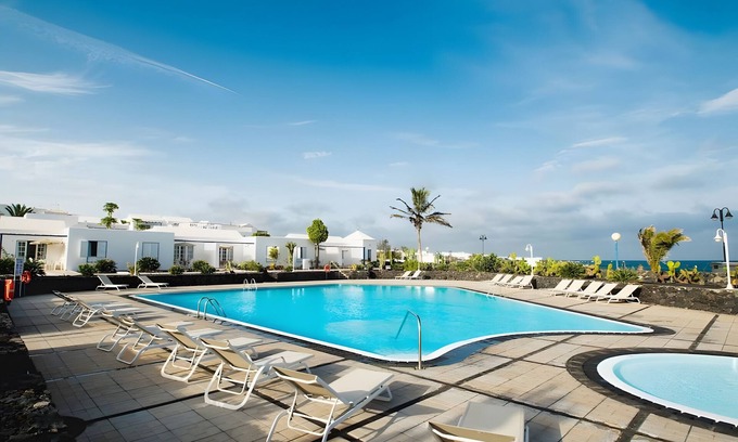 Arrieta House | Holiday Home 'Caleta Campos Bungalows' with Sea View, Shared Pool and Wi-Fi
