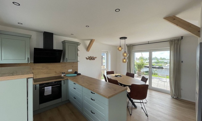 Bedekaspel House | Holiday Home 'Haus Am Meer 8' with Lake View, Private Terrace and Private Garden