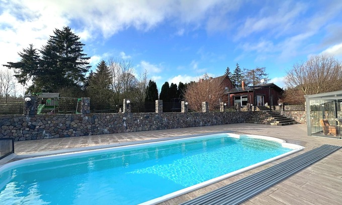 Dolgen am See House | Holiday Home MILA with Pool, Sauna, and Large Private Grounds