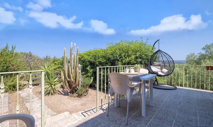 Paduledda House | Holiday Home "Vista Mozzafiato ad Isola Rossa" with Sea View, Private Terrace & A/C
