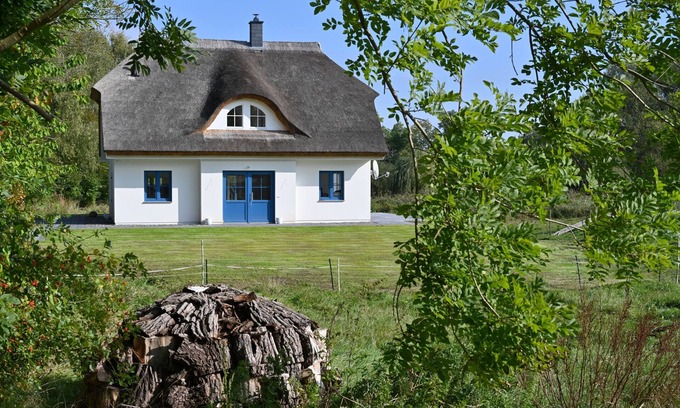 Puddemin House | Holiday home with thatched roof, large property and private road to the port