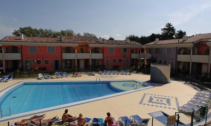 Bibione Lido del Sole Apartment | Holiday village escape with garden and fireplace