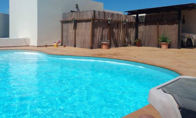 Tahiche Apartment | Homerez - Nice studio for 2 ppl. with swimming-pool and terrace at Tahiche