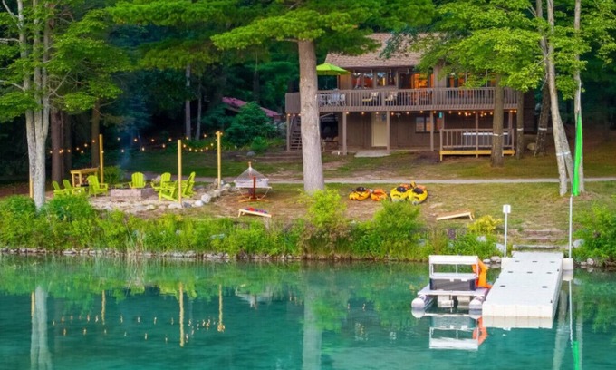 Newaygo House | Hot Tub, Water Amenities, Lakeshore Cottage